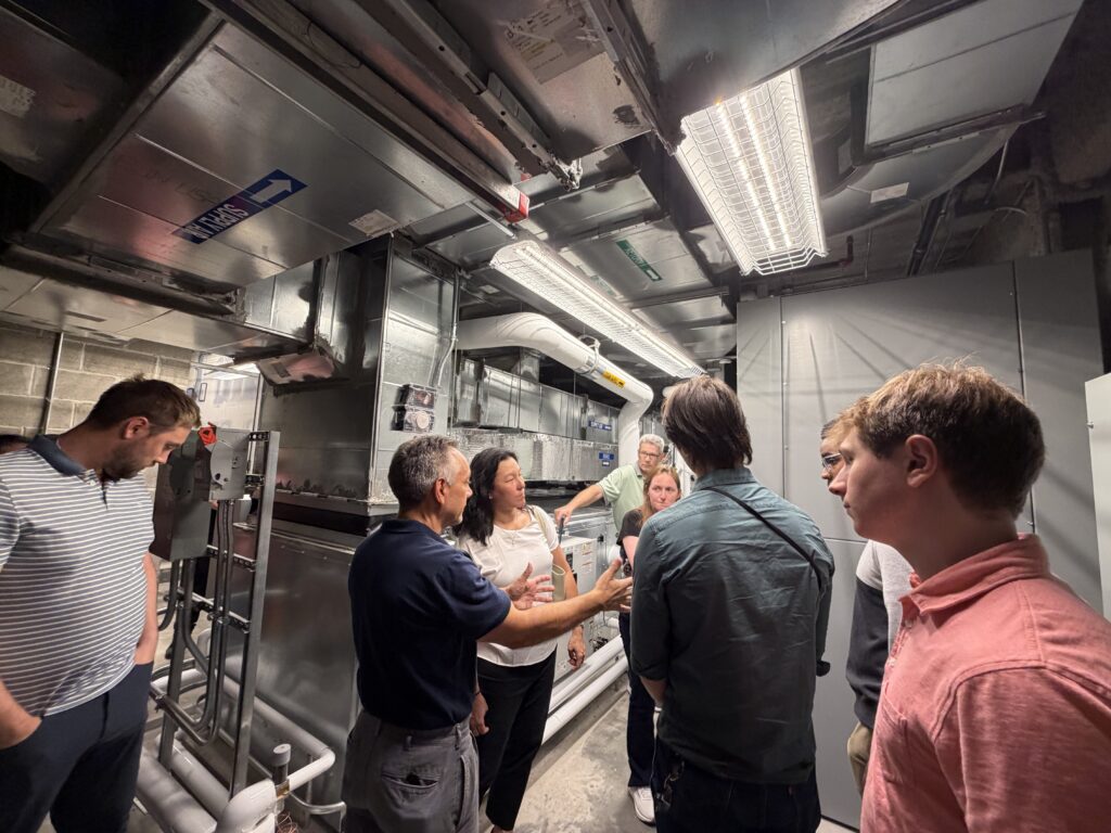Engineering interns and staff during a site visit at the Bruce Museum